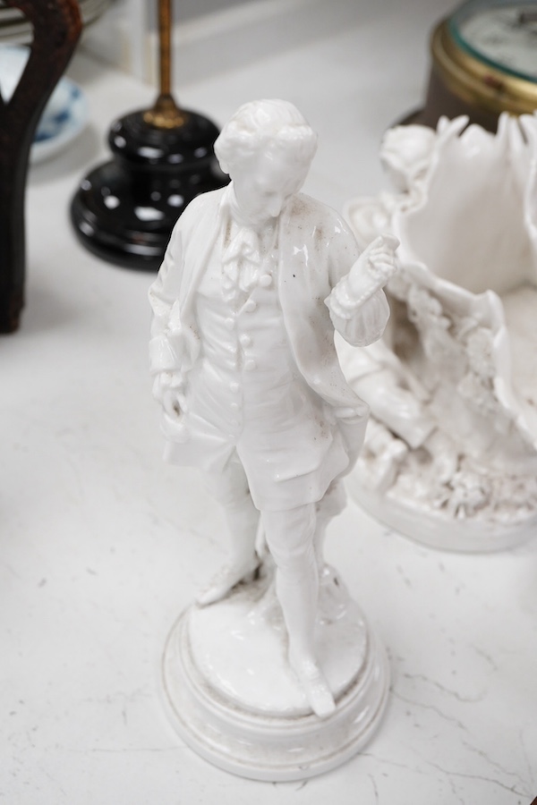 Three Continental white glazed figures and an English bone china group, tallest 25cm